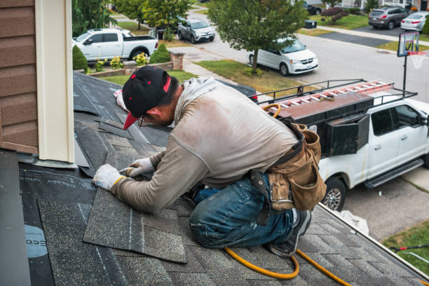 Professional Roof Replacement technician working in Wolcott, VT